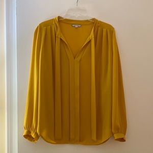 Yellow blouse with ties